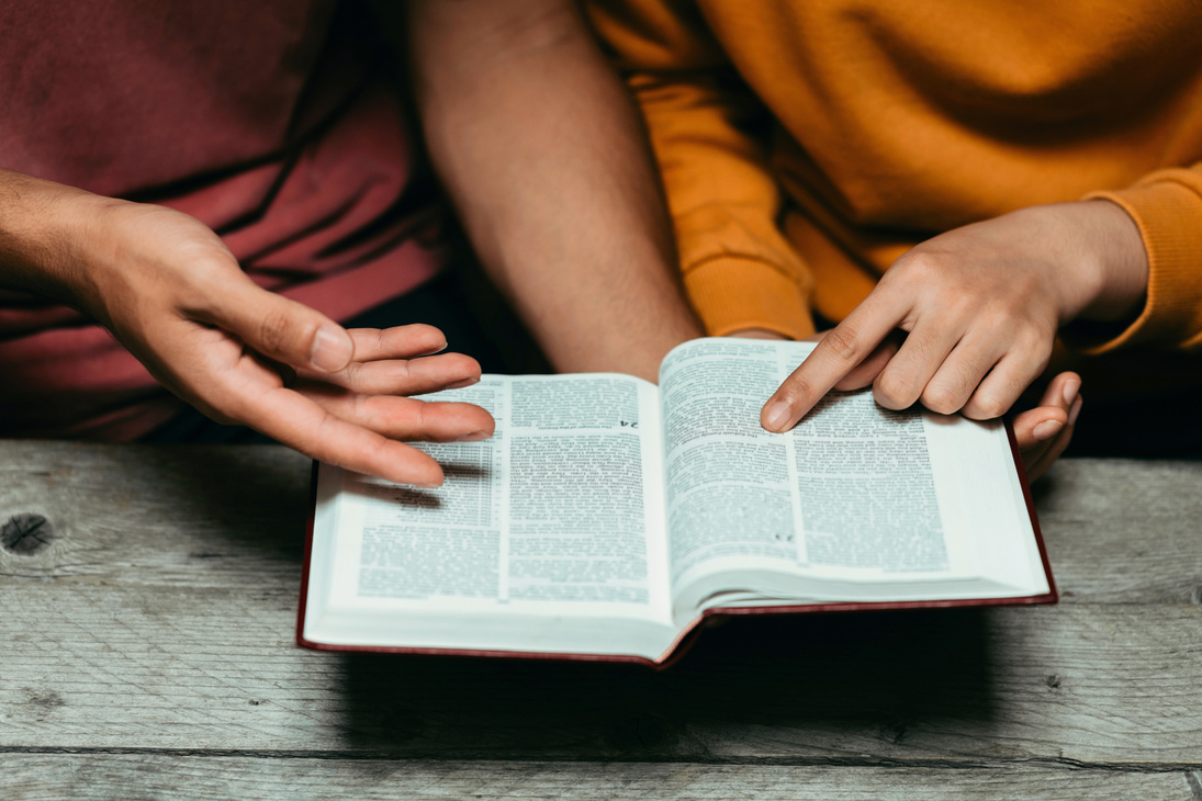 Christian Couples Read and Study the Bible at Home or in Sunday